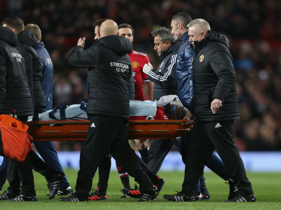 Romelu Lukaku is carried off on a stretcher, with an oxygen mask over his face. (Getty)