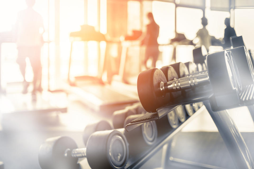 Rows of dumbbells in the gym with hign contrast and monochrome color tone