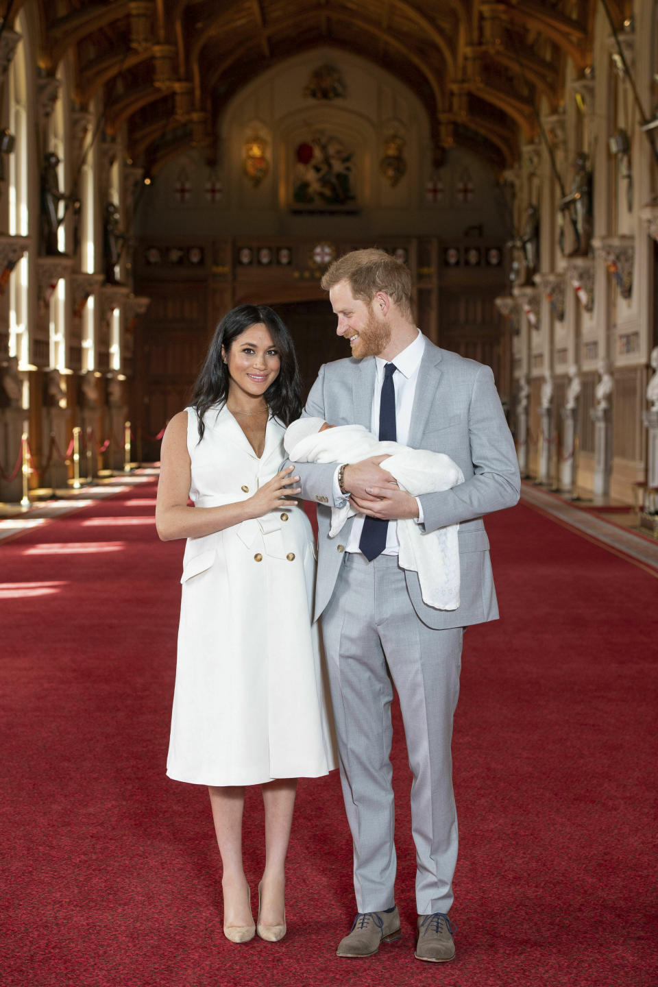 Meghan Markle and Prince Harry debuted their baby boy, Archie Harrison Mountbatten-Windsor, two days after his arrival on May 6, 2019. Markle wore a double-breasted and belted white dress by Grace Wales Bonner. (Photo: Getty Images)