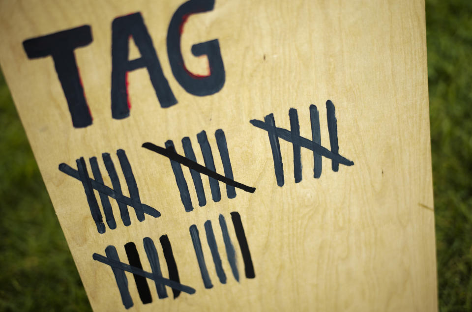 A wooden board marks the duration of hunger strike of climate activists in small camp near the chancellery in Berlin, Wednesday, Sept. 22, 2021. With the hunger strike climate activists hope to pressure candidates for chancellor of Germany into meeting with them for a debate about the climate crisis ahead Sunday's general election. For the first time in Germany's history, climate change is a central issue of an election campaign, overwhelmingly so for the young generation. (AP Photo/Markus Schreiber)