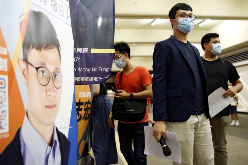 FILE PHOTO: Political activist Ventus Lau Wing-hong speaks to the media after he was disqualified from running for election for the legislature in Hong Kong