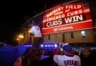 Oct 13, 2015; Chicago, IL, USA; Chicago Cubs fans take pictures outside after game four of the NLDS against the St. Louis Cardinals at Wrigley Field. Mandatory Credit: Jerry Lai-USA TODAY Sports
