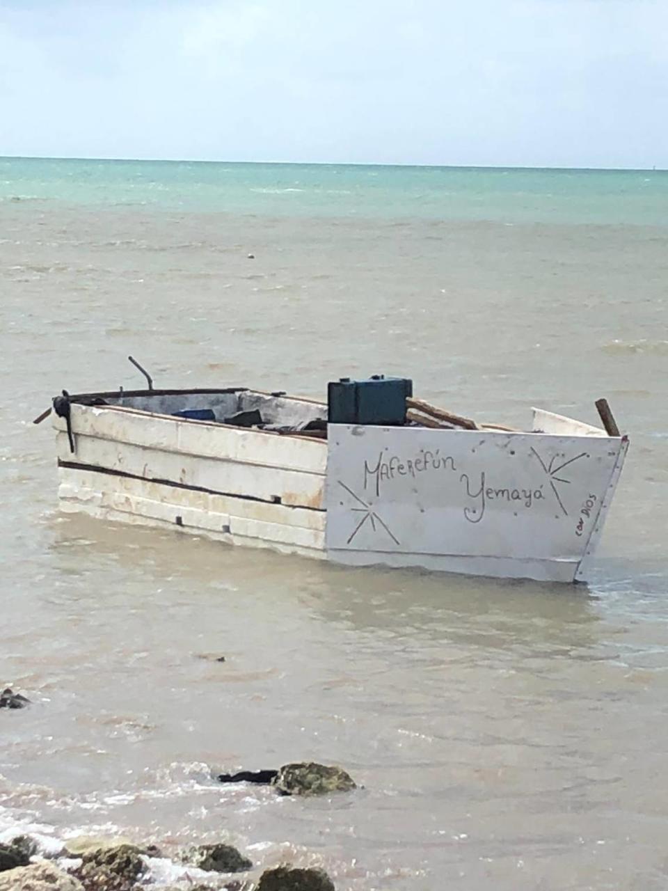 A Cuban migrant boat floats in the shallow waters off the Florida Keys Wednesday, May 25, 2022.