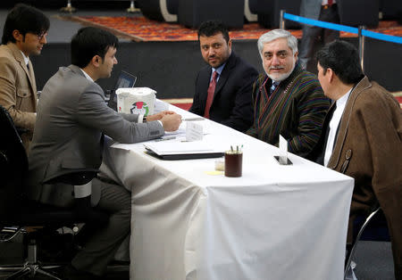 Afghanistan's Chief Executive Abdullah Abdullah, alongside his two vice-presidential candidates Enayatullah Babur Farahmand (L) and Asadullah Saadati (R), arrives to register as a candidate for the upcoming presidential election at the Afghanistan's Independent Election Commission (IEC) in Kabul, Afghanistan January 20, 2019.REUTERS/Omar Sobhani