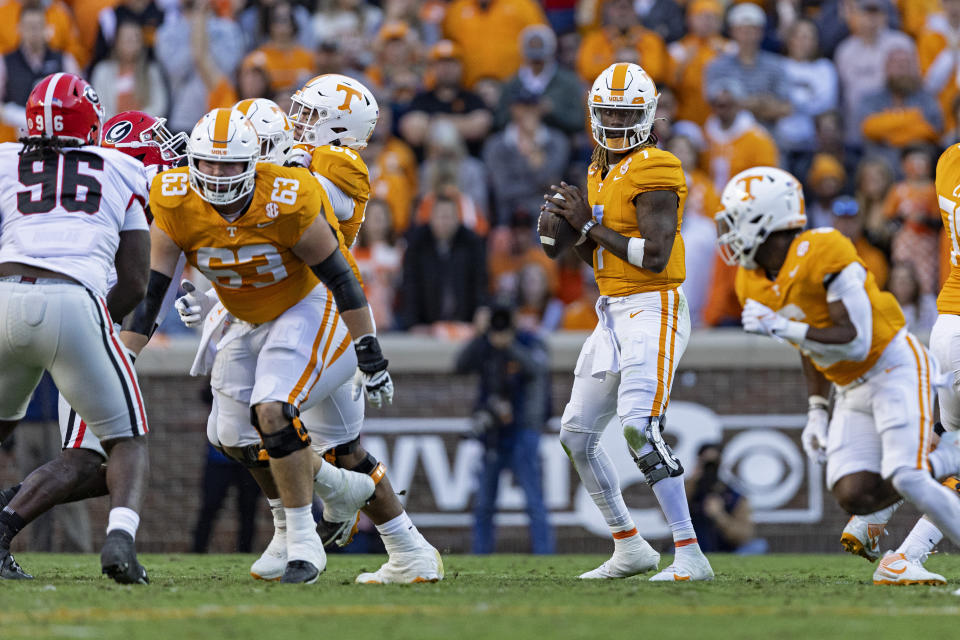 Tennessee quarterback Joe Milton III (7) looks for a receiver during the first half of an NCAA college football game against Georgia, Saturday, Nov. 18, 2023, in Knoxville, Tenn. (AP Photo/Wade Payne)