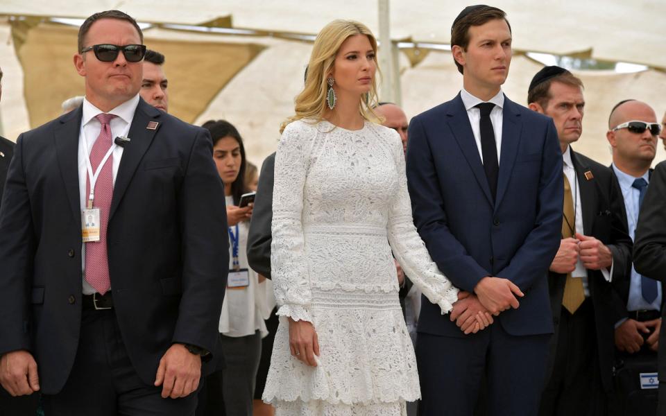 Mr Trump was accompanied by his daughter Ivanka Trump and son-in-law Jared Kushner, right - Credit: MANDEL NGAN/AFP