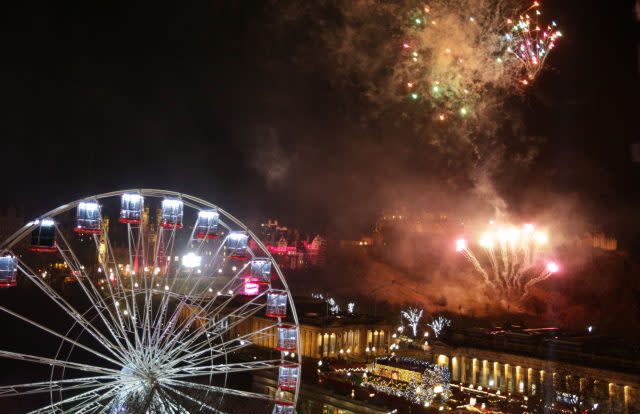 Fireworks light up the sky in Edinburgh during the Hogmanay New Year celebrations (David Cheskin/PA)