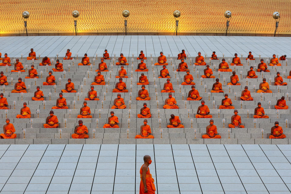 Buddhist monks pray at the Wat Phra Dhammakaya temple during a ceremony commemorating Makha Bucha Day in Pathum Thani province outside Bangkok on March 6, 2023.