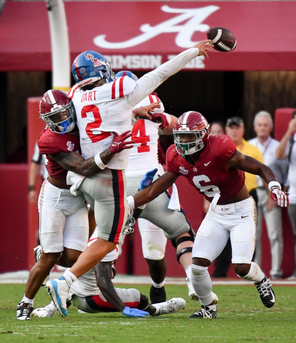 Sep 23, 2023; Tuscaloosa, Alabama, USA; Alabama Crimson Tide defensive back Malachi Moore (13) hits Mississippi Rebels quarterback Jaxson Dart (2) and causes an incomplete pass on fourth down at Bryant-Denny Stadium. Alabama defeated Mississippi 24-10. Mandatory Credit: Gary Cosby Jr.-USA TODAY Sports