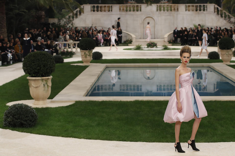 A model wears a creation for the Chanel Spring/Summer 2019 Haute Couture fashion collection presented in Paris, Tuesday Jan. 22, 2019. (AP Photo/Christophe Ena)