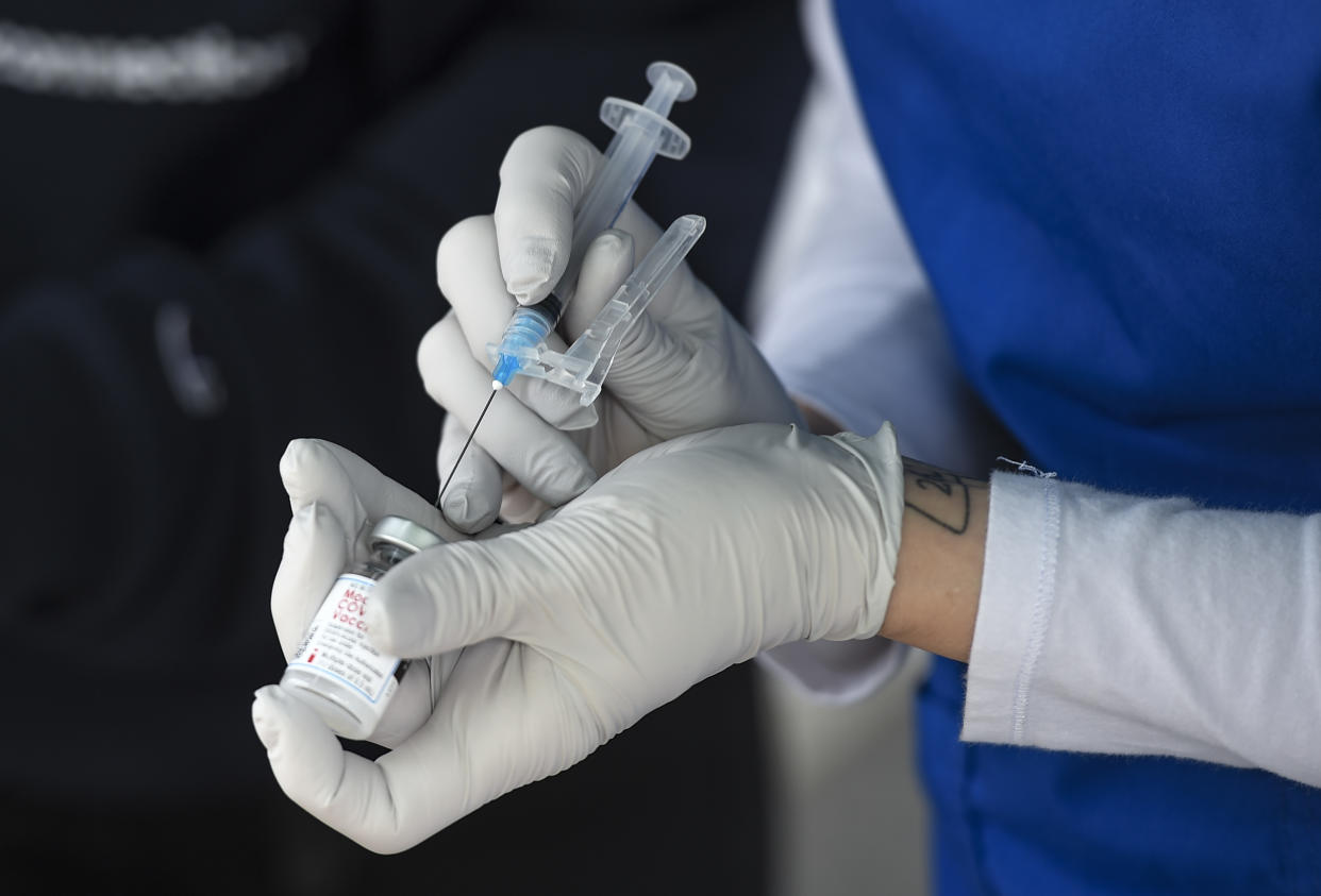 A nurse fills a syringe with COVID-19 vaccine. (Ben Hasty/MediaNews Group/Reading Eagle via Getty Images)