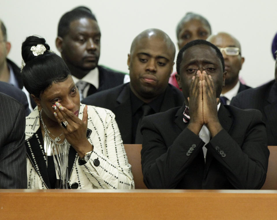 FILE - In this June 13, 2012 file photo, Constance Malcolm and Frank Graham, parents of 18-year-old Ramarley Graham, weep during the arraignment of Officer Richard Haste, in Bronx Supreme Court, in the Bronx borough of New York. Haste, a white police officer who fatally shot an unarmed black teenager, resigned Sunday, March 26, 2017, from the New York Police Department to avoid being fired following a disciplinary trial. He was brought on departmental charges for demonstrating "poor judgment" by not taking obvious steps to defuse a fatal standoff with Ramarley Graham. (AP Photo/Richard Drew, Pool, File)