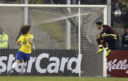 Venezuela's Miku (R) misses a scoring opportunity against Brazil during their first round Copa America 2015 soccer match at Estadio Monumental David Arellano in Santiago, Chile, June 21, 2015. REUTERS/Jorge Adorno