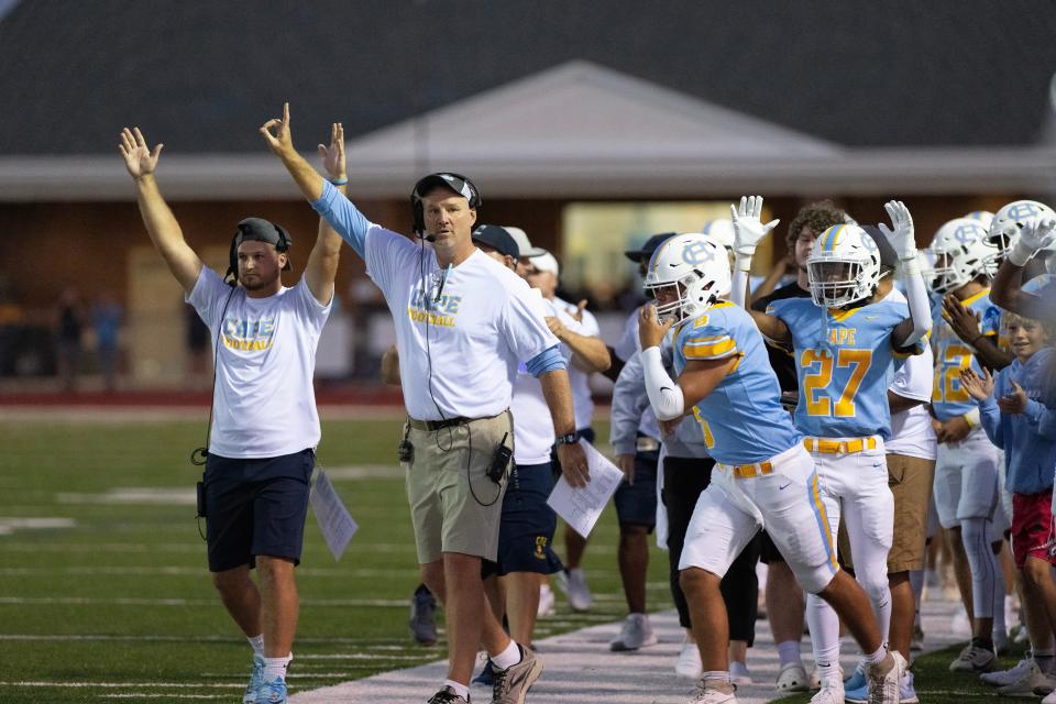 Cape Henlopen coach Mike Frederick, a former NFL defensive end, celebrates a touchdown with his team in the season opener Aug. 31 against Red Lion Christian. The Vikings have reached the championship game of the DIAA Class 3A playoffs and will meet Salesianum at 7 p.m. Friday at Delaware Stadium.