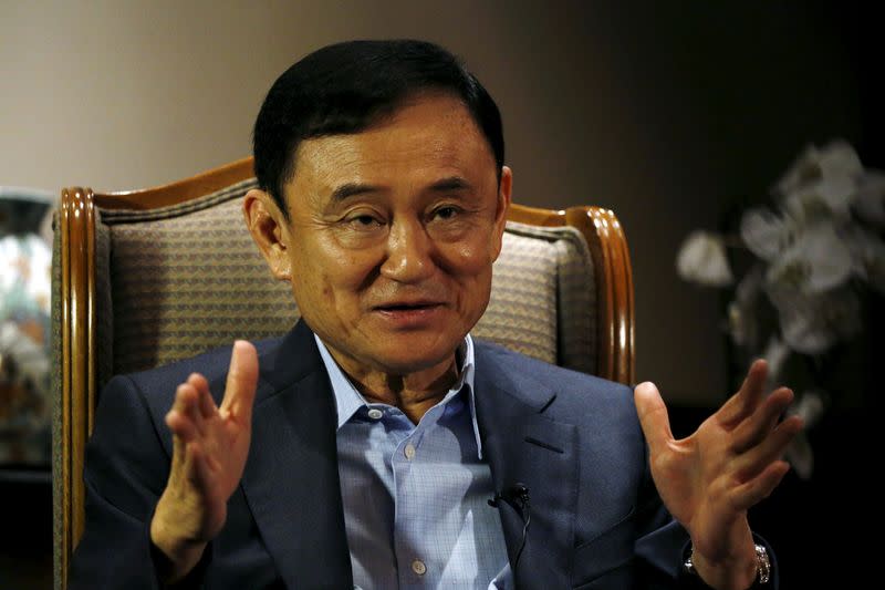 FILE PHOTO: Former Thai Prime Minister Thaksin Shinawatra speaks to Reuters during an interview in Singapore