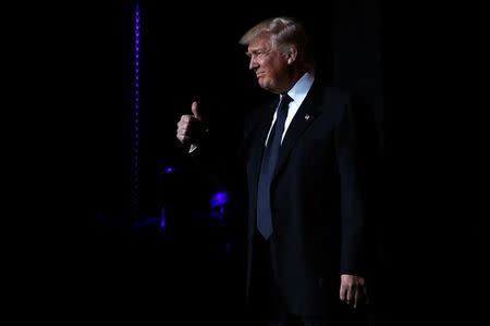 U.S. President-elect Donald Trump speaks to diplomats at the Presidential Inaugural Committee (PIC) Chairman's Global Dinner in Washington, U.S. January 17, 2017. REUTERS/Jonathan Ernst