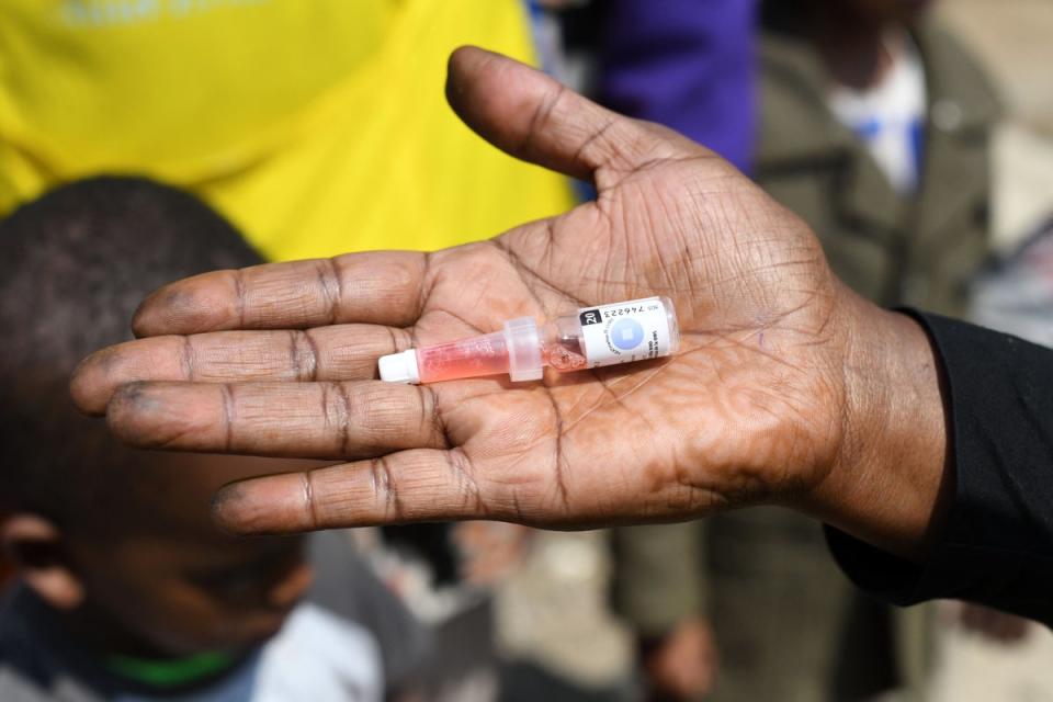 A community health worker with a dose of the polio vaccine (AFP/Getty)