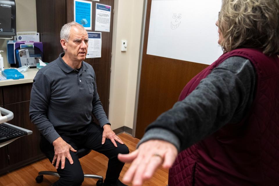 OhioHealth chief of neurology Dr. Geoffrey Eubank watches patient Janet Tharp during an appointment Wednesday at the health system's Riverside Methodist Hospital.