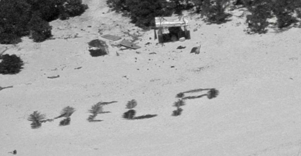 Three fishermen stranded for more than a week on tiny island in the Pacific Ocean were rescued after they spelled out "HELP" in palm fronds.