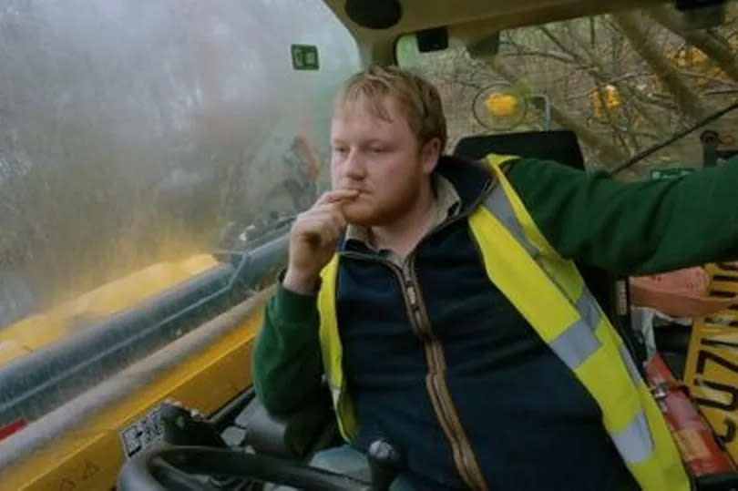 Kaleb Cooper pensive in his tractor