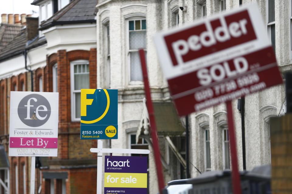 Estate agents boards are lined up outside houses in south London June 3, 2014. Britain's house prices rose at their fastest annual pace in nearly seven years last month and signs of bottlenecks in the construction sector underscored the upward pressures on the market, surveys showed on Tuesday. House price growth picked up to an annual pace of 11.1 percent in May, mortgage lender Nationwide said, fanning concerns that the property market could be overheating.  REUTERS/Andrew Winning   (BRITAIN - Tags: POLITICS BUSINESS REAL ESTATE)