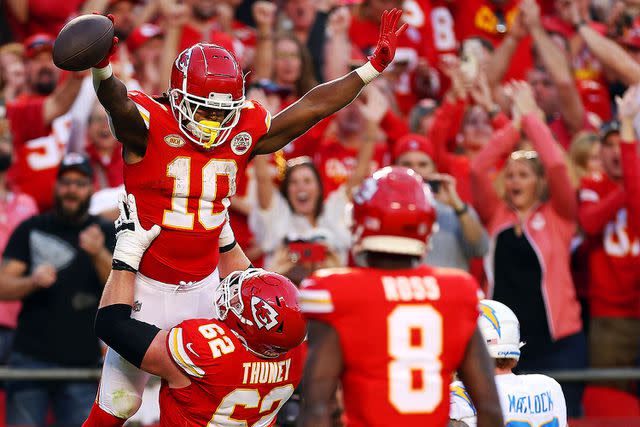 <p>Jamie Squire/Getty Images</p> Isiah Pacheco celebrates after a touchdown during a game against the Los Angeles Chargers on Oct. 22, 2023.