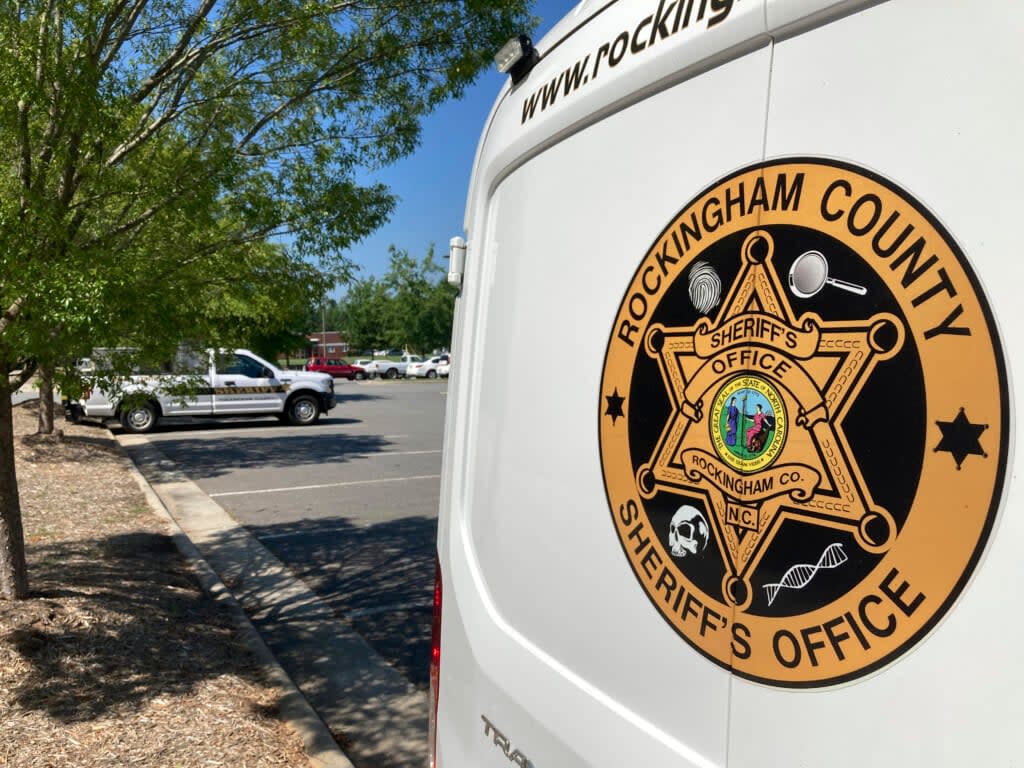 A crime scene unit van sits outside the Rockingham County Sheriff’s Department in Wentworth, N.C., on Saturday, July 23, 2022. (AP Photo/Allen G. Breed)