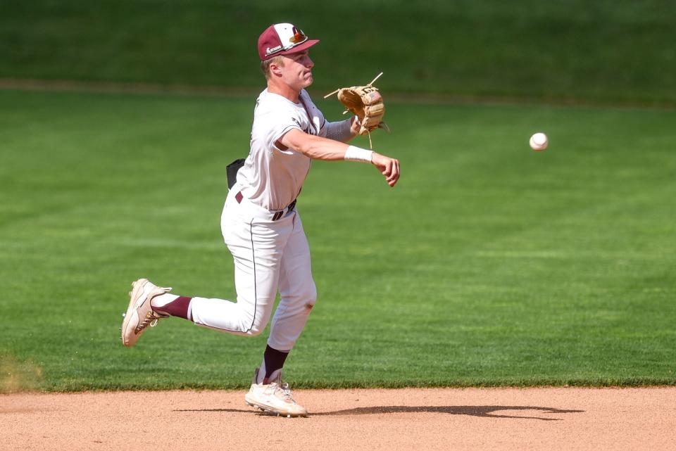 Okemos' Caleb Bonemer throws an Olivet batter out at first base during the second inning on Wednesday, May 31, 2023, at McLane Stadium on the Michigan State campus in East Lansing.