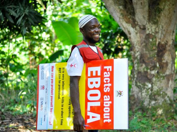 Adam, a volunteer in Bundibugyo, goes door-to-door in hiscommunity (Uganda Red Cross/Aggrey Nyondwa)