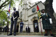 The Guard of Honour in place for the funeral of former RAF Sergeant Peter Brown from Jamaica, at St Clement Danes Church, in London, Thursday May 25, 2023. Flight Sgt. Peter Brown who flew bombing missions in World War II after volunteering for the Royal Air Force died in December, aged 96. Volunteers tried to track down family and people who knew him. Word of that search drew interest from others who didn't want him to be forgotten for the service he offered in Britain's darkest hour. (Victoria Jones/PA via AP)
