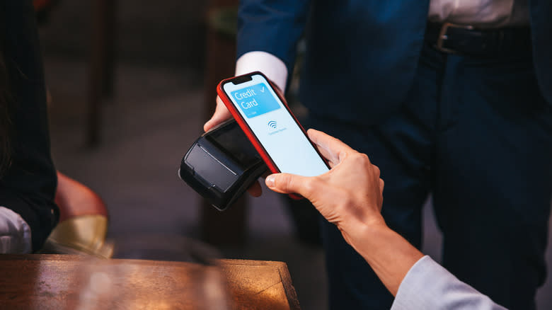 Customer paying for meal with phone