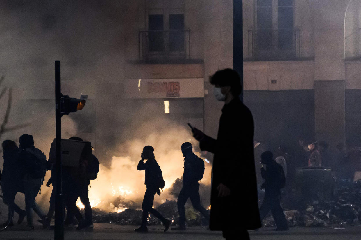 The French president on March 16 rammed a controversial pension reform through parliament without a vote, deploying a rarely used constitutional power that risks inflaming protests. The move was an admission that his government lacked a majority in the National Assembly to pass the legislation to raise the retirement age from 62 to 64.  (Loic Venance / AFP - Getty Images)