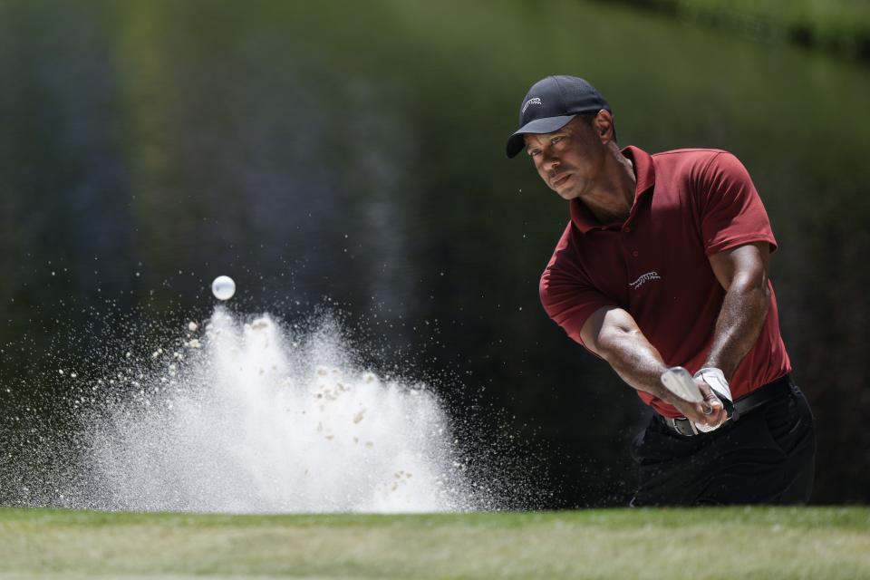 Tiger Woods hits from the bunker on the 16th hole during final round at the Masters golf tournament at Augusta National Golf Club Sunday, April 14, 2024, in Augusta, Ga. (AP Photo/Charlie Riedel)