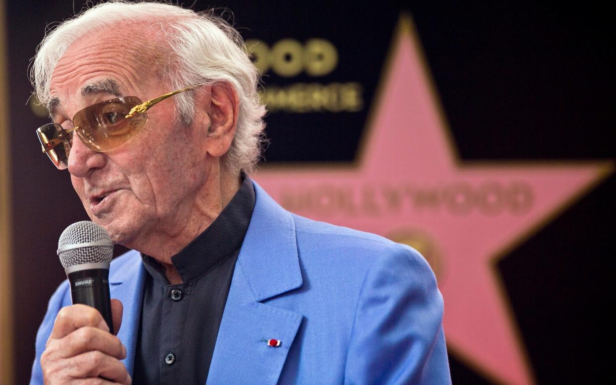 Charles Aznavour appears at a ceremony honouring him with a star on the Hollywood Walk of Fame in Los Angeles. - AP