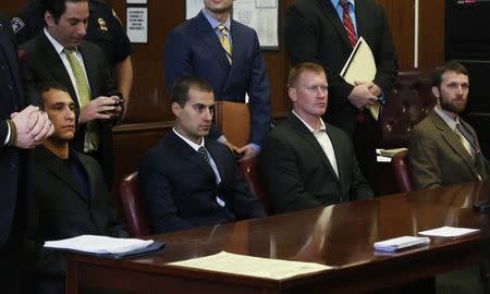 (L to R seated) Andrew Rossig, Marco Markovich, James Brady and Kyle Hartwell appear in Manhattan Criminal Court in New York May 6, 2014. REUTERS/Brendan McDermid