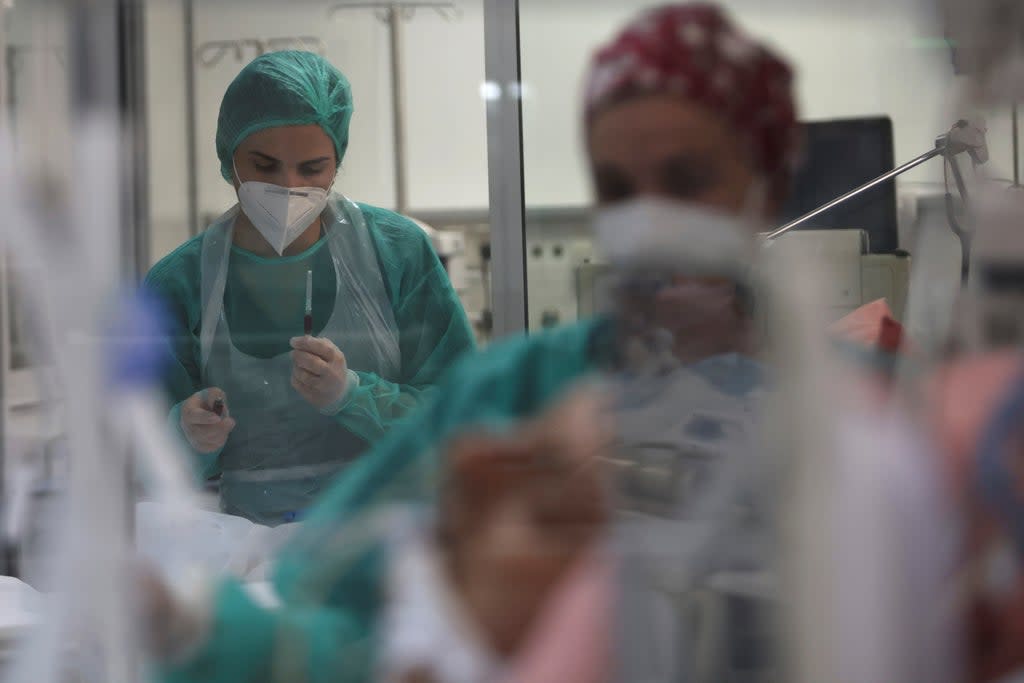 Members of the medical staff treat coronavirus disease positive patients at the intensive care unit (ICU) of the Sotiria hospital, in Athens (REUTERS)
