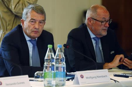 UEFA executive committee member Wolfgang Niersbach and Chairman of Swiss Football Association Peter Gillieron (R) attend the UEFA executive committee meeting in Basel, Switzerland May 18, 2016. REUTERS/Ruben Sprich