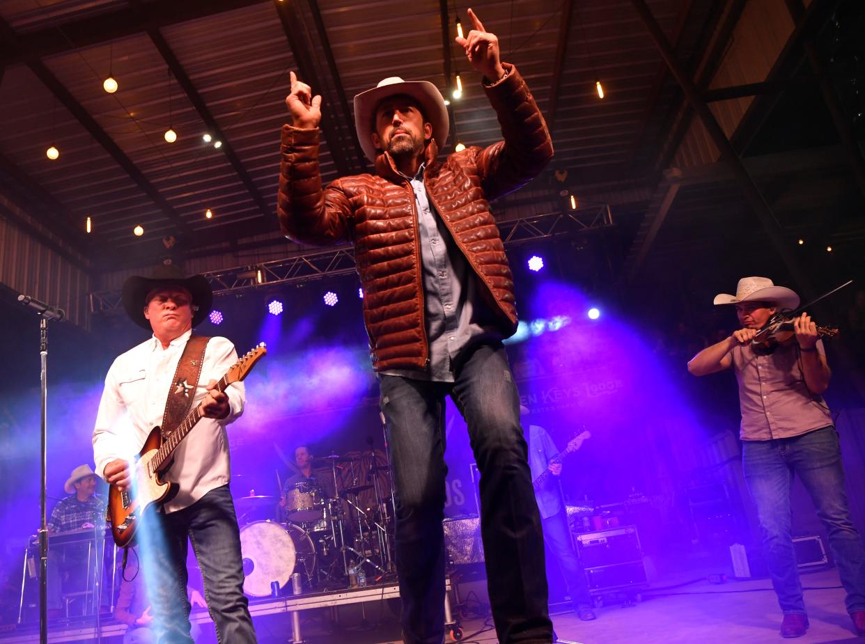 Outlaws & Legends Music Fest founder Mark Powell performs with Kevin Fowler during his Saturday set on April 1, 2023.