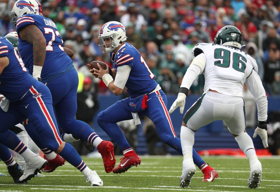 Bills quarterback Josh Allen decides to keep the ball and run for a first down against the Eagles.<br>Jg 102719 Bills 11b