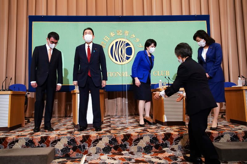 Candidates for the presidential election of the ruling Liberal Democratic Party prepare to pose for photographers prior to a debate session held by Japan National Press Club