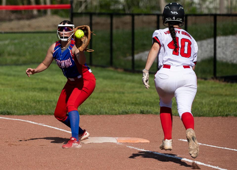 Lakewood's Madee Osborn catches a throw at first to retire a Liberty Union batter May 10 during a Division III tournament game. Osborn underwent open heart surgery March 2 and returned to the diamond April 27.