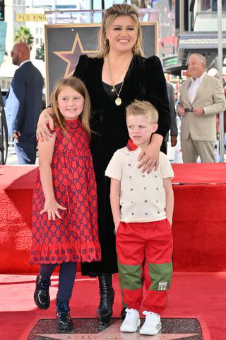 <p>Michael Buckner/Variety via Getty</p> Kelly Clarkson with her kids on the Hollywood Walk of Fame on September 19, 2022