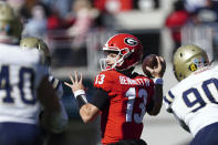 Georgia quarterback Stetson Bennett (13) throws a pass in the first half of an NCAA college football game against Charleston Southern, Saturday, Nov. 20, 2021, in Athens, Ga. (AP Photo/John Bazemore)