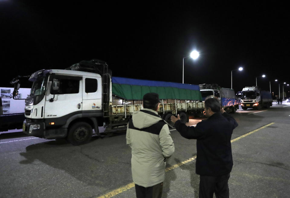 Trucks carrying insecticide wait to leave for North Korea at the Unification Bridge, in Paju, South Korea, Thursday, Nov. 29, 2018. South Korea has sent about 50 tons of insecticide to North Korea to help stop a pine tree disease from spreading. (AP Photo/Lee Jin-man)