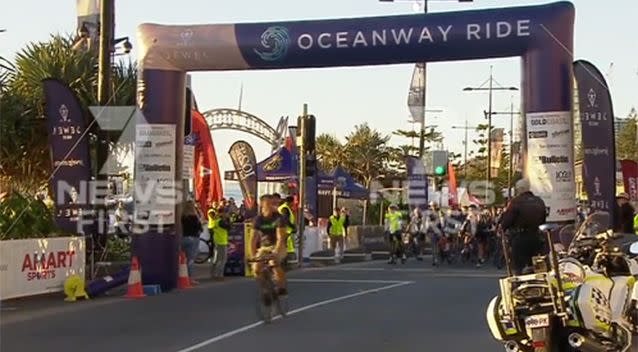 The man made his way through the crowd and emerged on a bike during the national anthem. Source: 7 News