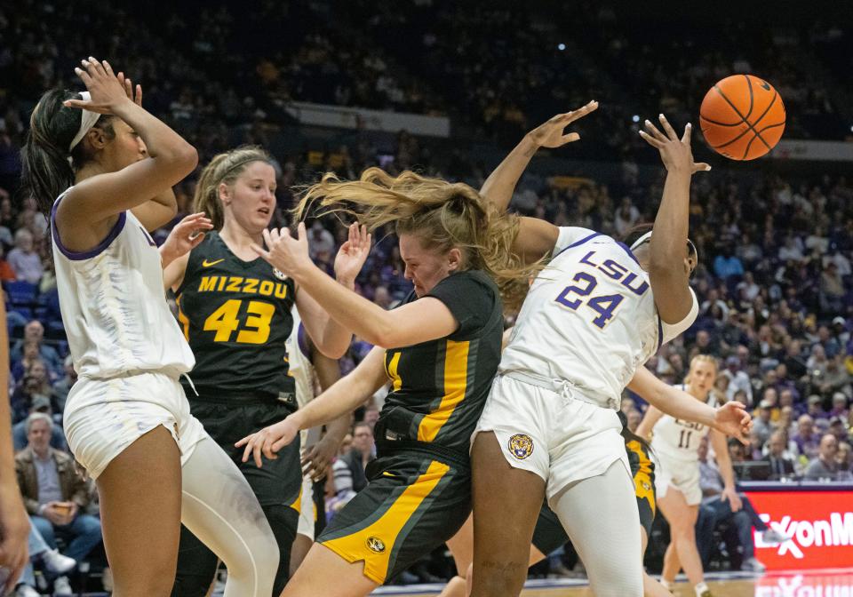 LSU forward Angel Reese, left, Missouri forward Hayley Frank (43), Missouri guard/forward Abby Feit, third from left, and LSU guard Aneesah Morrow (24) react after a rebound during an NCAA college basketball game Thursday, Jan. 4, 2024, in Baton Rouge, La. (Hilary Scheinuk/The Advocate via AP)