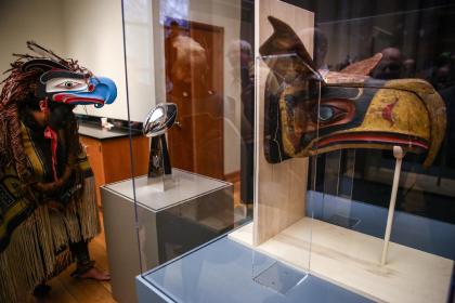 The mask that inspired the Seahawks logo, right, is unveiled at the Burke Museum at in Seattle. (AP Photo)