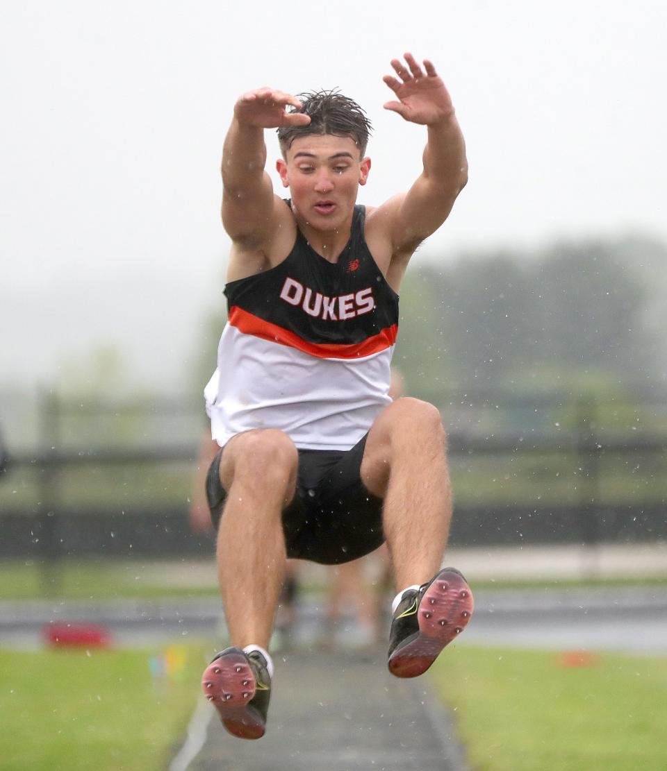 Marlington's Cameron Evanich leaps in the long jump during Saturday's Eastern Buckeye Conference Track and Field Championships.