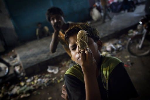 A Pakistani street child sex worker is seen sniffing glue in Karachi. According to charities which work to protect street children in Pakistan, up to 90 percent are sexually abused on the first night that they sleep rough and 60 percent accuse police of sexually abusing them