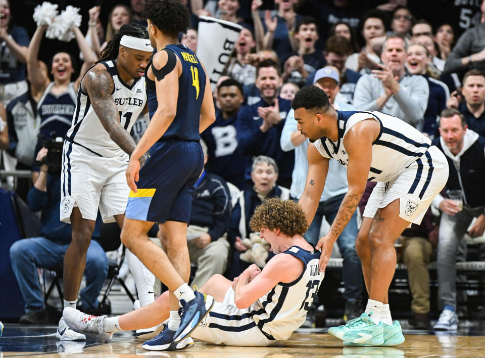 Butler Bulldogs guard Finley Bizjack (13) celebrates after making a shot and being fouled against the Marquette Golden Eagles during the second half at Hinkle Fieldhouse.
